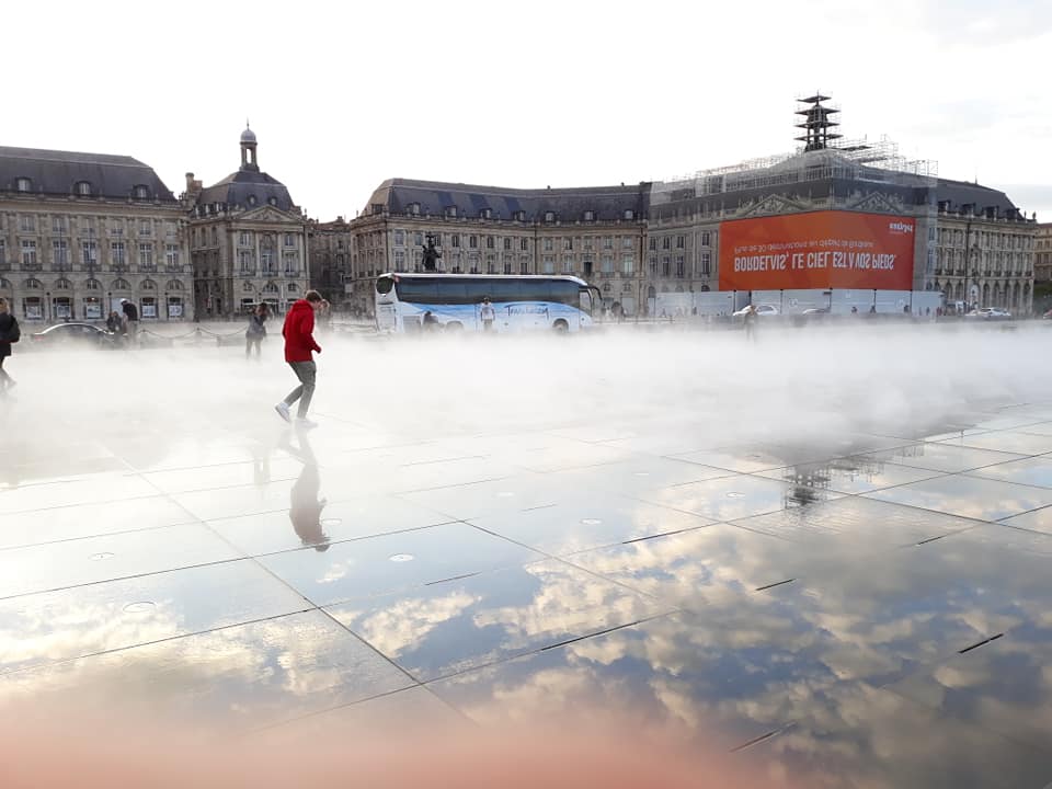 My son enjoyingthe reflectionsf Bordeaux